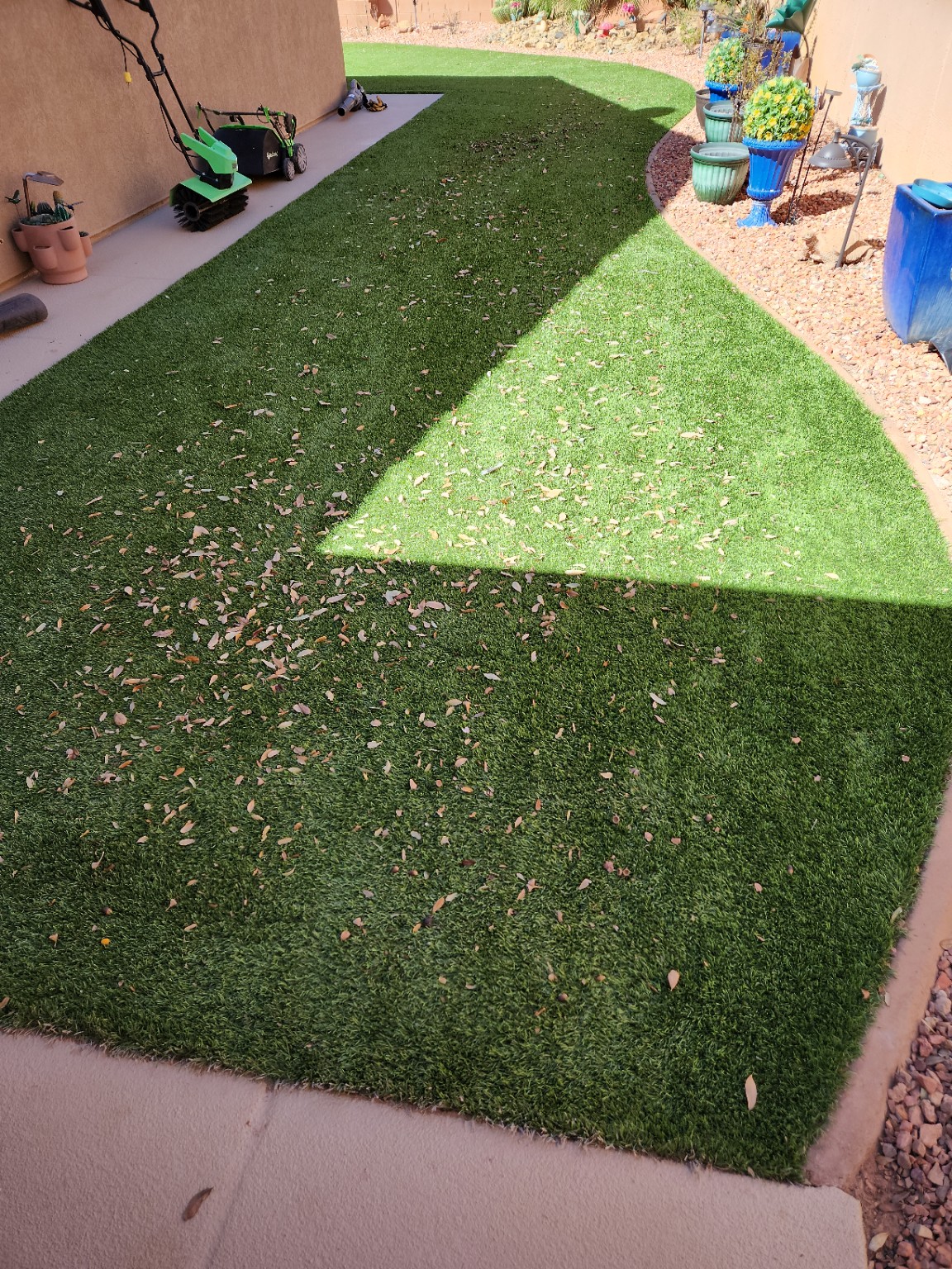 Before full turf Reset: leaf and debris buildup on artificial turf in Ivins, Utah
